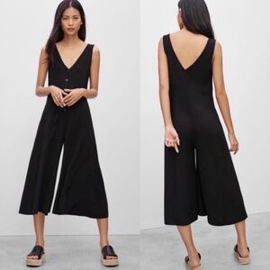 Aritzia Talula Black Jumpsuit with flare leg, size 6